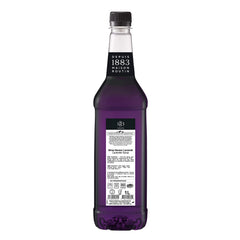 Pouring 1883 Lavender Syrup for rich latte or tea