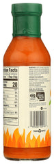 Organic buffalo wing sauce bottle close-up with bold branding.