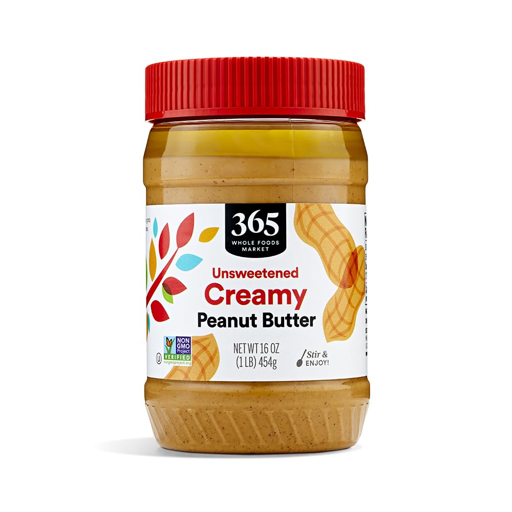 365 by Whole Foods Market creamy peanut butter jar on the kitchen counter, ready to spread.
