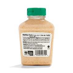 365 by Whole Foods Market organic German mustard bottle on picnic table perfect for summer grilling.