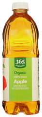 Pouring 365 by Whole Foods Market apple juice into a glass for a refreshing morning.