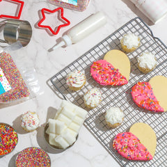 A Great Surprise sprinkles scattered on cake and cupcakes for decoration
