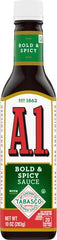 Pouring A.1 Tabasco sauce on wings for zing