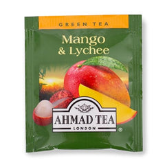 Ahmad Tea Mango & Lychee fruit pieces closeup, real fruit bits enhancing flavor.