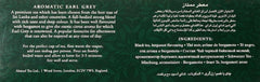 Ahmad Tea steeping tea bag releases citrusy bergamot notes during infusion.