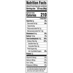 Close-up of roasted hazelnuts, almonds, and raisins in Alpen Original Muesli for a flavorful texture.