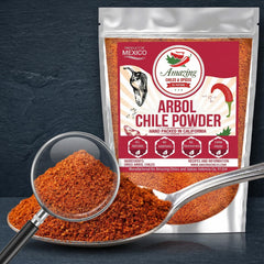 Amazing Chiles & Spices arbol powder on a spoon adds smoky heat for recipes.