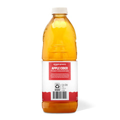 Amazon Grocery Apple Cider 64oz in a glass, perfect for sipping or recipe splash.