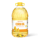 Amazon Grocery Corn Oil 128oz bottle on kitchen counter for versatile cooking.