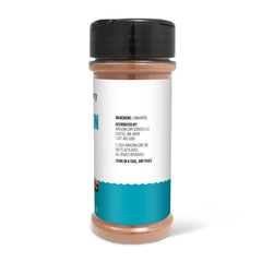 Amazon Grocery ground cinnamon powder dust on spoon reveals warm aroma for baking.