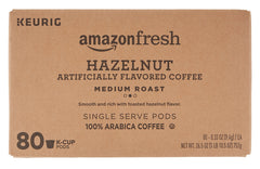 Keurig-compatible AmazonFresh hazelnut K-Cup shown during machine-ready brewing.