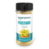 Amazon Grocery ground mustard bottle with bold yellow content for flavor boost.