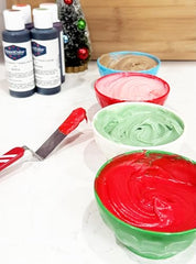 Americolor Soft Gel Paste Soft Red on creamy icing yields smooth color.