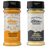 Amish Country Popcorn cheddar seasoning bottle ready to flavor crunchy kernels.