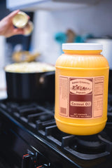 Amish Country Popcorn coconut oil non-GMO badge signals clean ingredients for mindful snacking