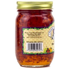 Amish Wedding hot pepper jam served on cheese board with crackers.