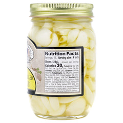 Amish Wedding sweet pickled garlic jar closeup showcasing glossy brine and plump cloves.