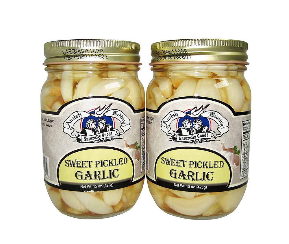 Amish Wedding sweet pickled garlic in two jars, ready to elevate antipasti and sauces.