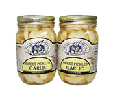 Amish Wedding sweet pickled garlic in two jars, ready to elevate antipasti and sauces.