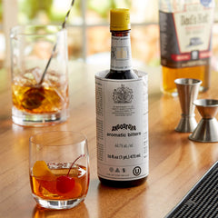 Pouring Angostura Aromatic Bitters to flavor a cocktail