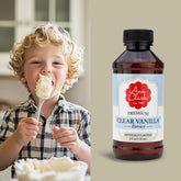 Ann Clark Premium Clear Vanilla Extract bottle pour demonstrates color-free vanilla for baking.