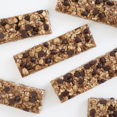 Annie's Organic Chewy Granola Bars on the go with a backpack, quick snack.