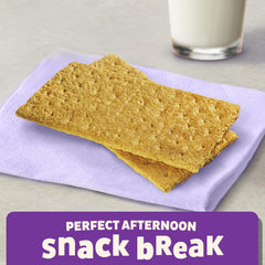 Annie's Honey Graham Crackers paired with nut butter for a tasty, energy-boosting bite.