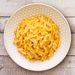 Annie's Vegan Mac and Cheddar sauce packet emphasizes dairy-free flavor