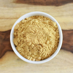 Closeup of Anthony's Organic Ground Ginger Root jar reveals powder texture and color