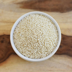 Anthony's Organic Hulled Sesame Seeds hand pouring shot suggests easy topping and flavor boost
