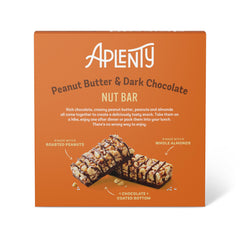 Aplenty dark chocolate peanut butter bar held in hand for a quick grab-and-go snack.