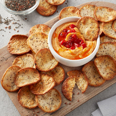 Aplenty pita chips arranged on a platter, perfect for quick party snacks.