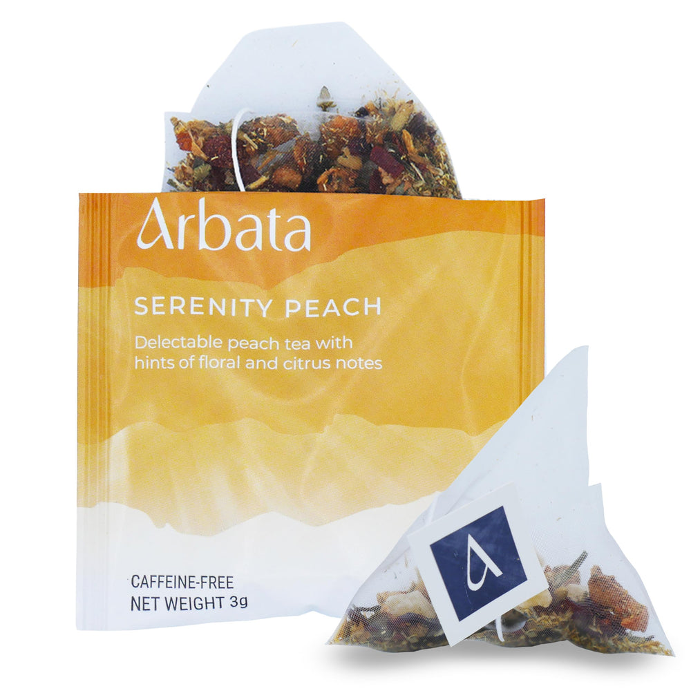 Arbata Serenity Peach Tea packaging and pyramid sachet, signaling premium, caffeine-free flavor