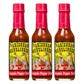 Arizona Gunslinger Red Jalapeño Sauce bottle close-up, bold flavor for tacos.