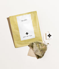 Sachets packaging of Art of Tea Organic Happy Tea showing individual wrappers