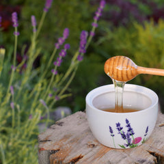 Arvoli Lavender Honey on a tea setup, natural sweetener with floral notes.