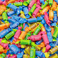 Assortit Tootsie Roll Fruit Chews bag close-up showing colorful five-flavor assortment for parties