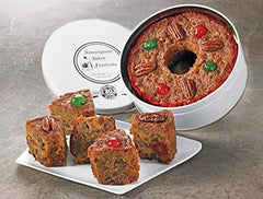 Assumption Abbey fruitcake slice on plate paired with coffee.