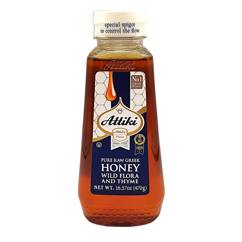 Attiki pure Greek honey with thyme and wildflowers in a bottle, ideal for drizzling.