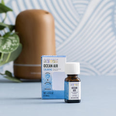 Aura Cacia Ocean Air drops close-up revealing subtle natural tint.