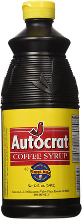 Autocrat Coffee Syrup bottle pour enhances rich flavor in drinks.