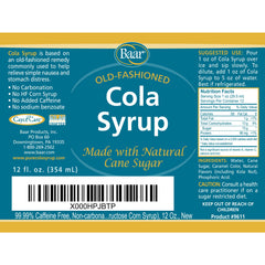Pour Baar Cola Syrup into a glass for a simple non-carbonated treat