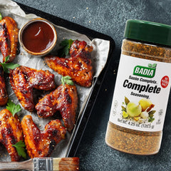 Badia Complete Seasoning Salt-Free on meats for grilling and roasting flavor.