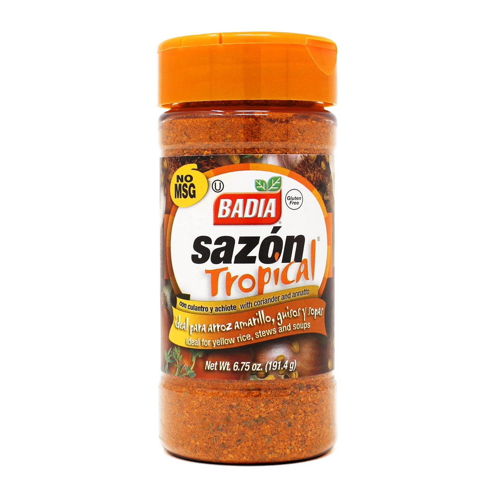 Badia Sazón Tropical bottle pouring to add golden color and aroma to meats