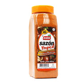 Badia Sazón Tropical bottle pouring over poultry for vibrant flavor and color.