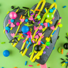 Close-up of BakeBright neon sprinkles adding retro flair to cupcakes
