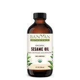 Banyan Botanicals Sesame Oil bottle close-up, pure unrefined oil for daily skin care.