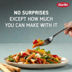 Close-up of Barilla red lentil penne texture showing hearty bite.