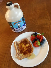 Barred Woods amber-rich maple syrup drizzled on waffles for a cozy morning.