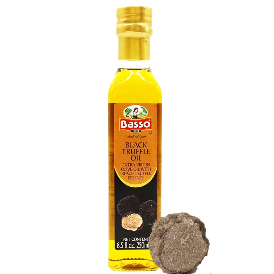 BASSO 1904 black truffle oil bottle pouring to finish pasta with earthy aroma
